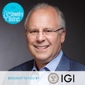 John Green smiles with the Jewelry District and IGI logos above and below his face.
